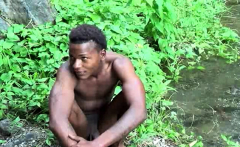 Brown soldier strips naked by the stream