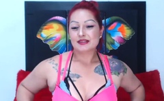 Redhead camgirl in three bras stripping