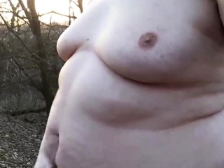 Chubby masturbates in the woods
