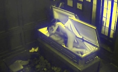 Slut fucks in coffin