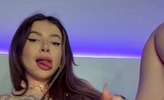 Adrianna Savu, slavering as she fellates her fingers, makes